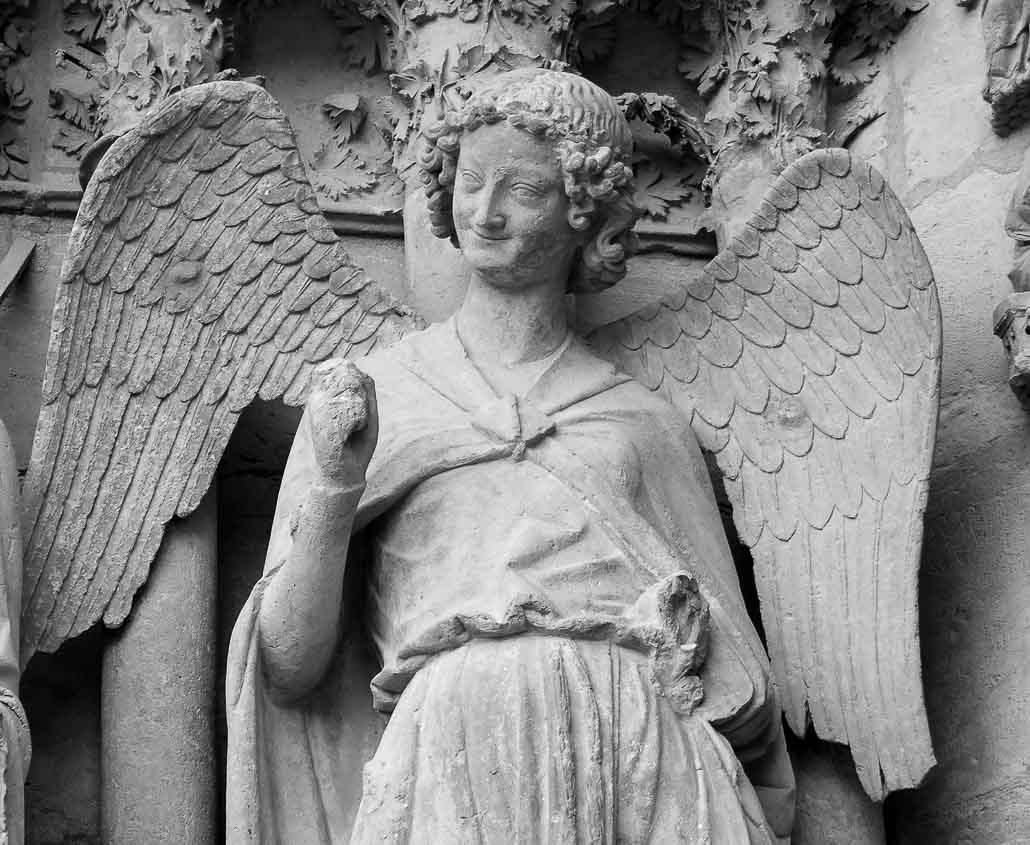 Sourire de Reims, vers 1240, portail nord de la façade occidentale de la cathédrale de Reims.
